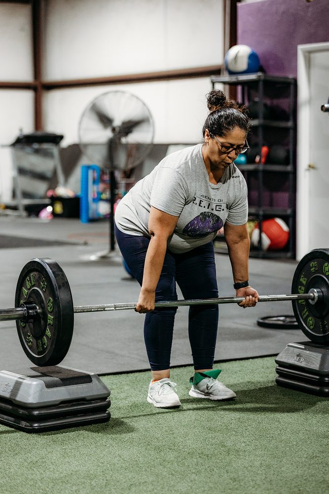 A member deadlifting during a strength session