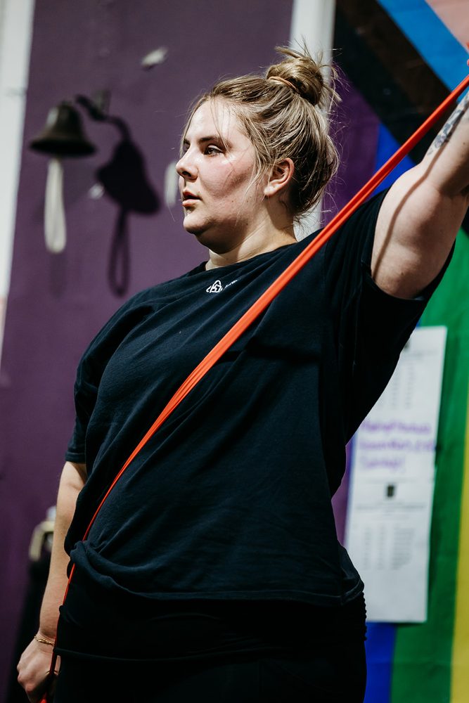A member training overhead with a resistance band